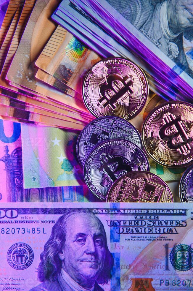 Bitcoin on background of US dollars, euro banknotes. Electronic decentralized money, exchange rate and growth of crypto currency photo