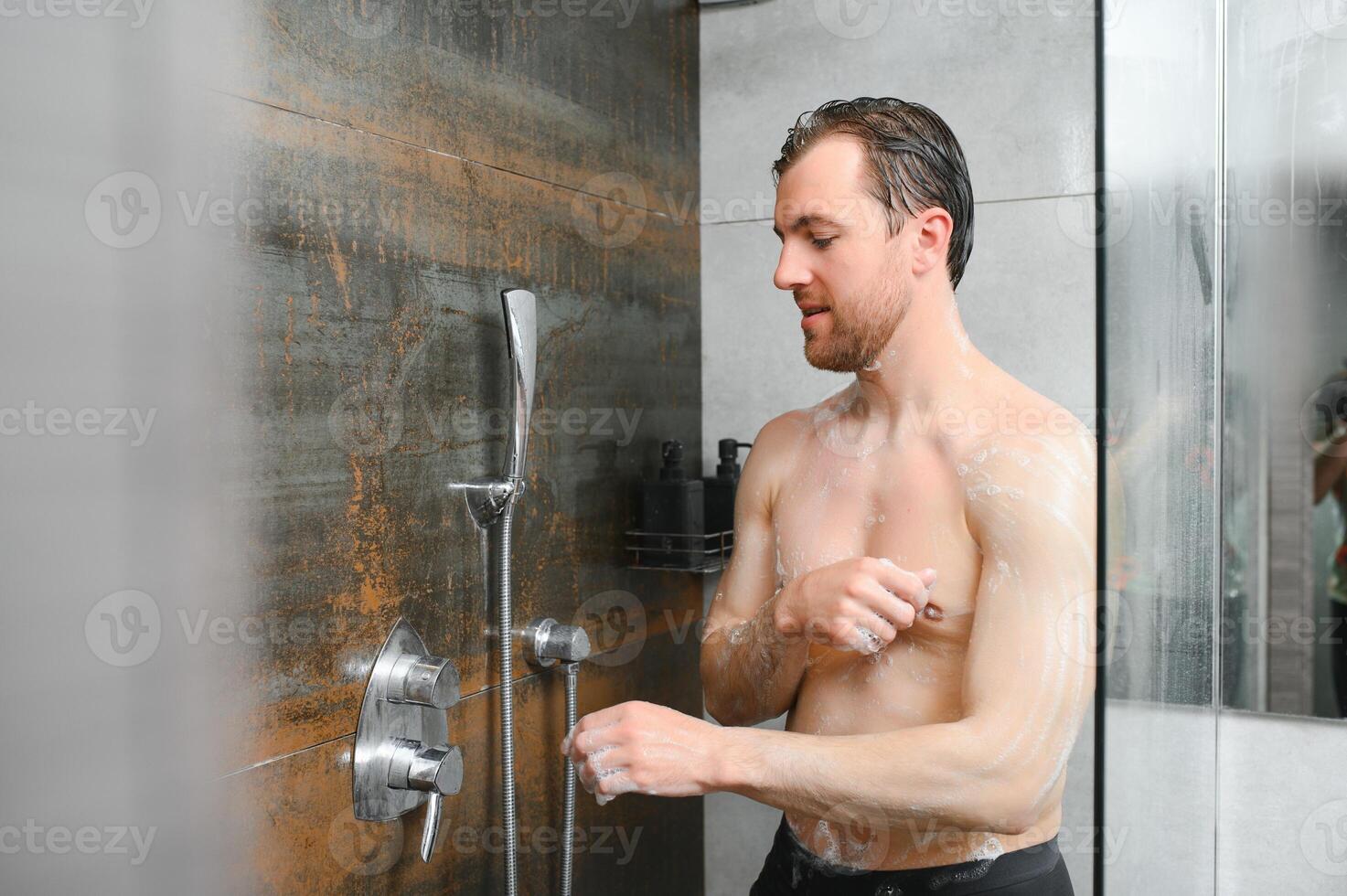 Man warming up in the shower photo