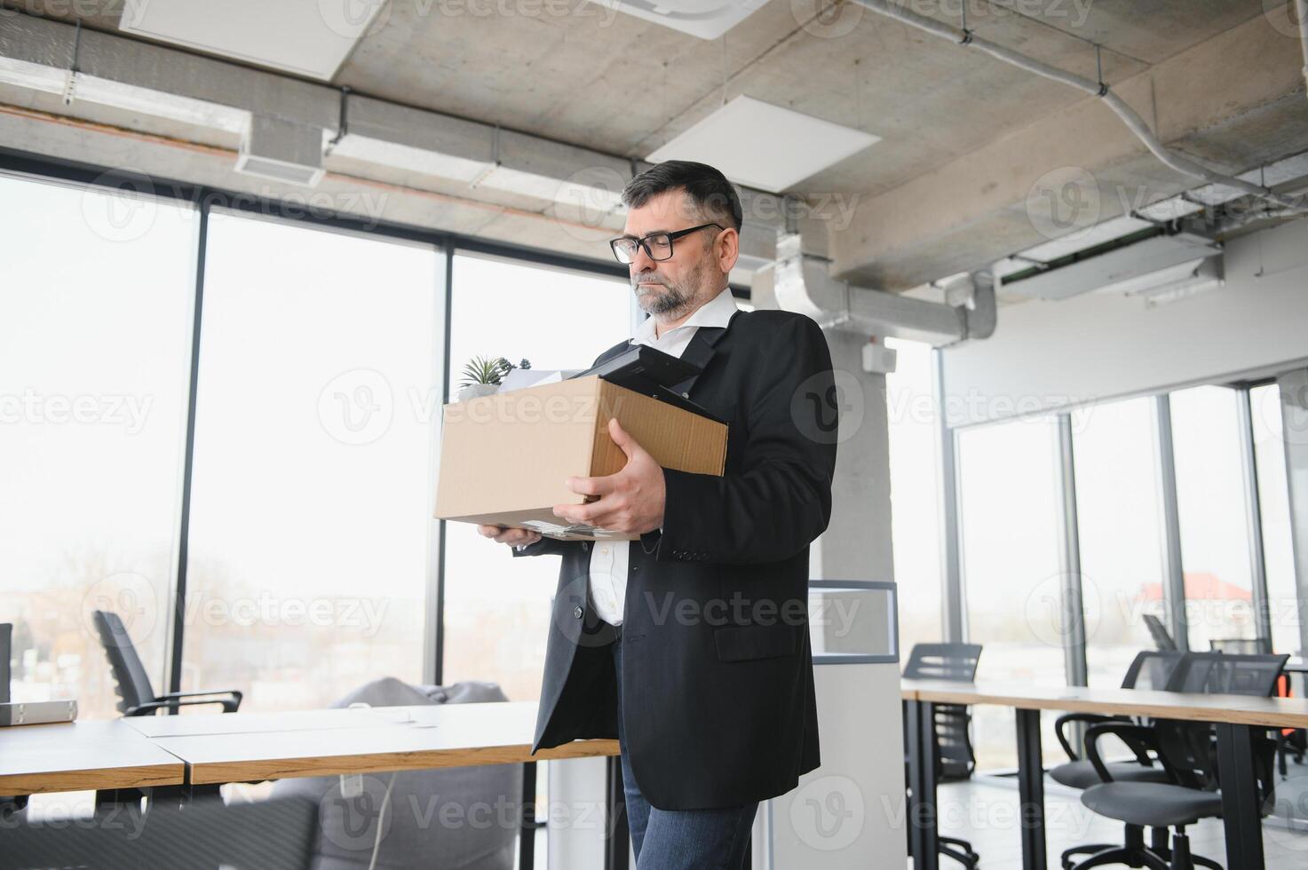 Old male employee in dismissal concept photo