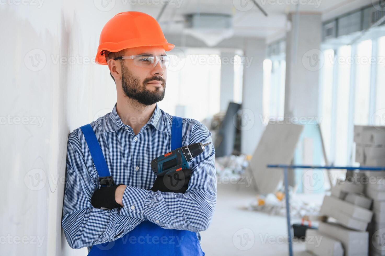 Construction worker use a drill bit photo