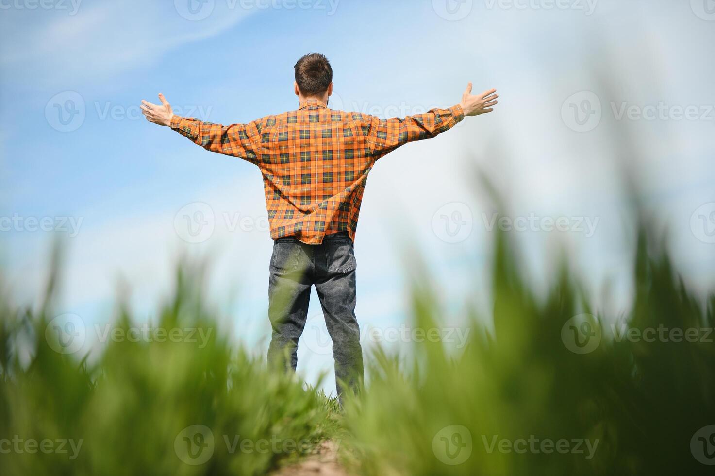Portrait of farmer standing in field. photo