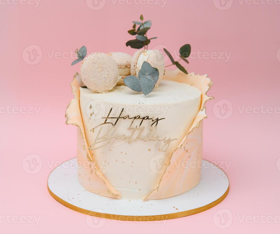 Birthday cake isolated on pink background. Birthday party decorated cake with candles and sparkles. Copy space photo