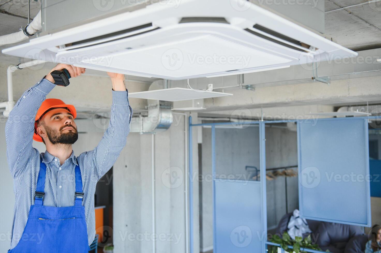 technician service checking and repairing air conditioner indoors photo