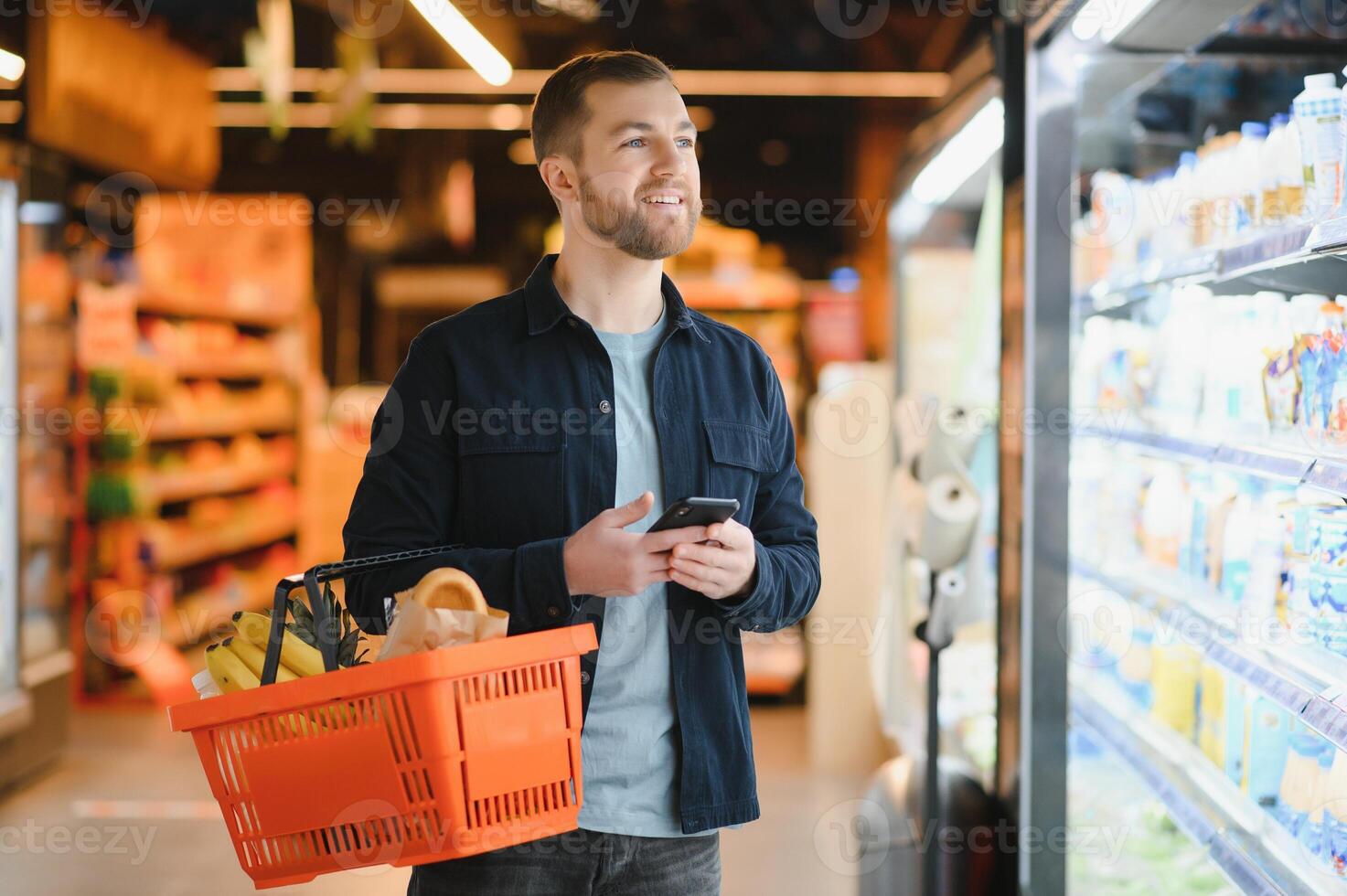 man in supermarket, grocery store customer photo