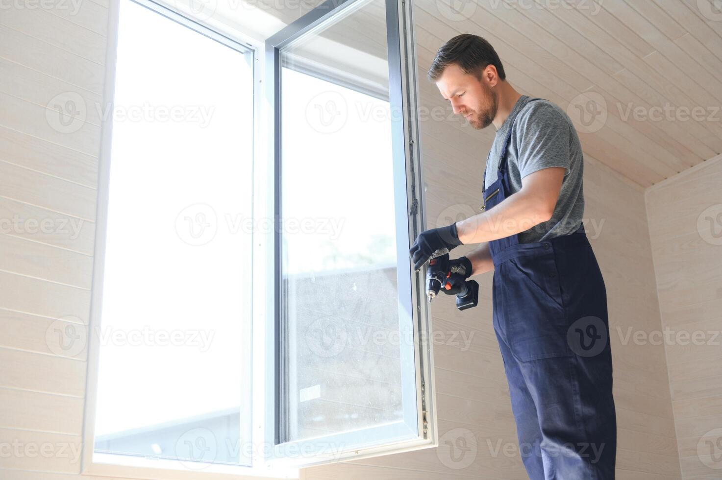 Process of construction new and modern modular house from composite sip panels. Worker man in special protective uniform wear working on building development industry of energy efficient property. photo