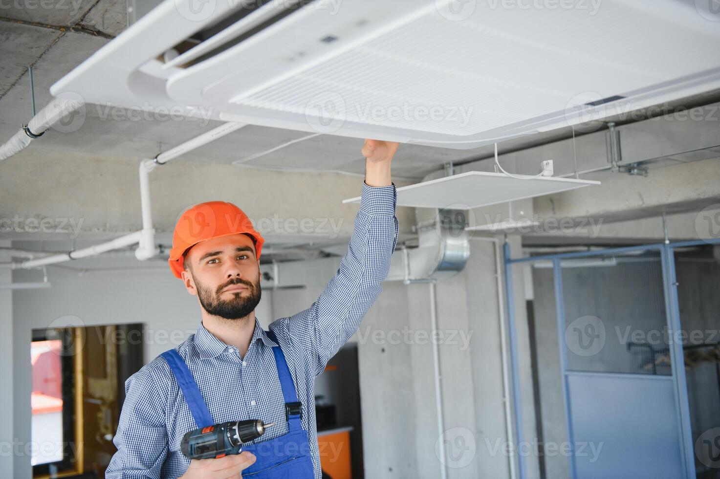 technician service checking and repairing air conditioner indoors photo