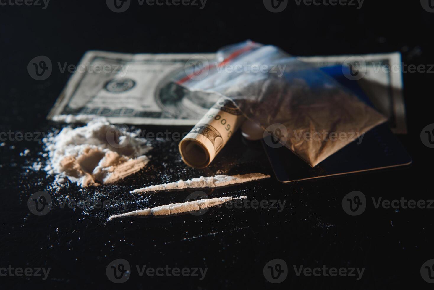 Cocaine and money isolated on black background. photo