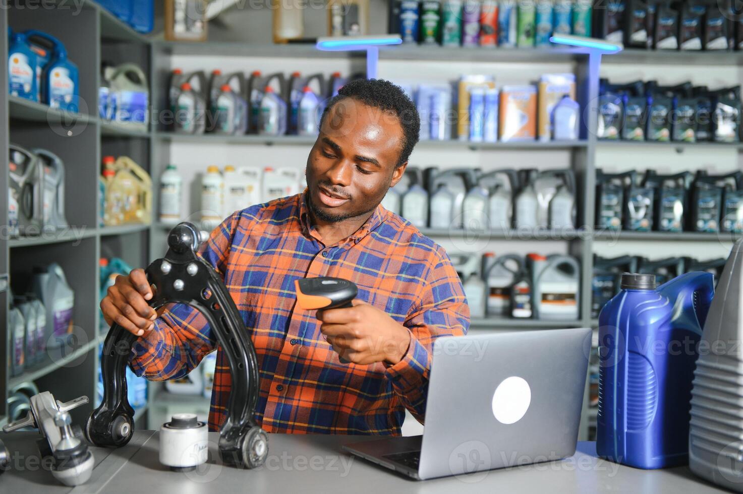 Smiling african Salesman Auto Parts Store photo