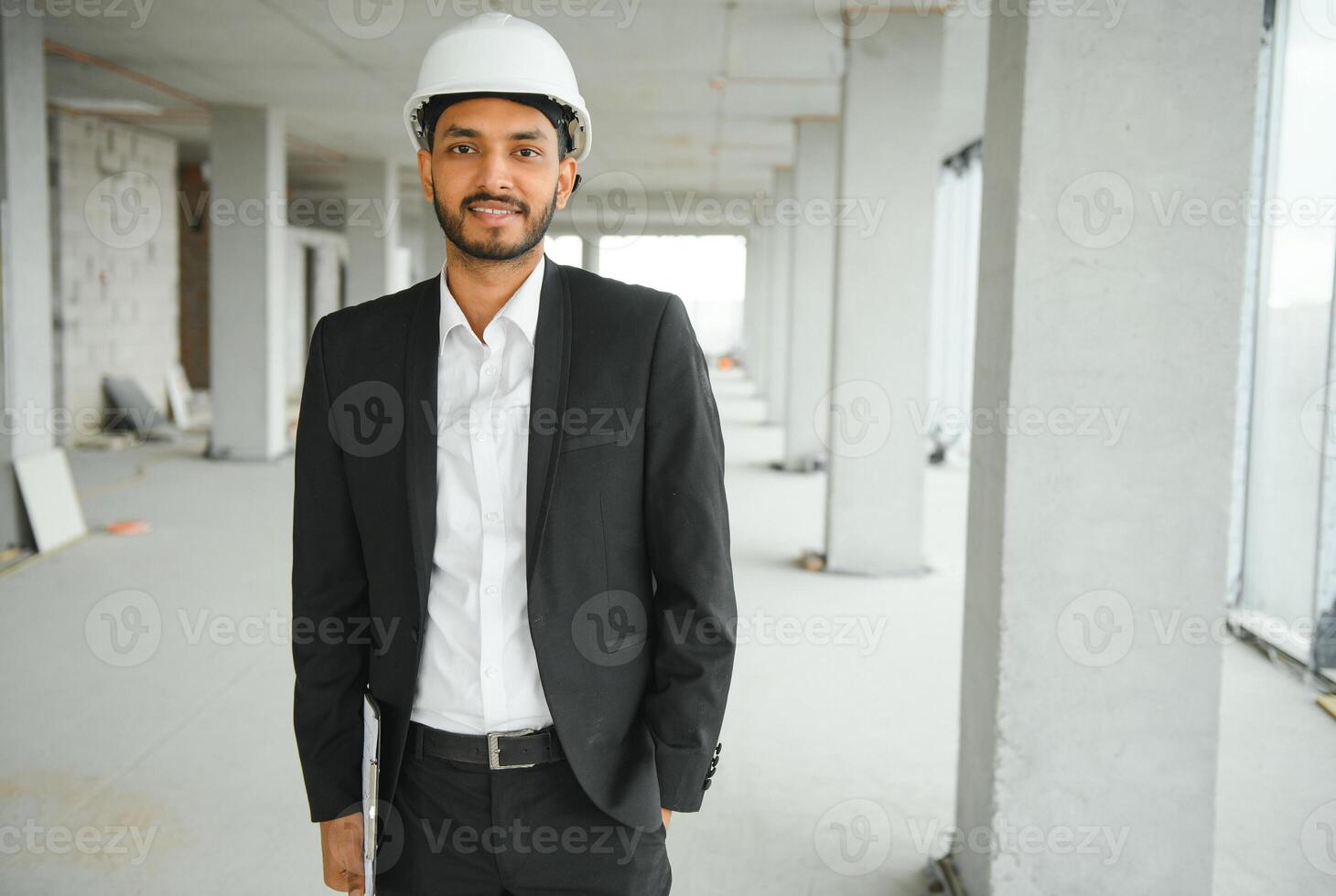 Asian Engineer standing on site construction posting confident , Engineer construction happy job success with in target planning photo