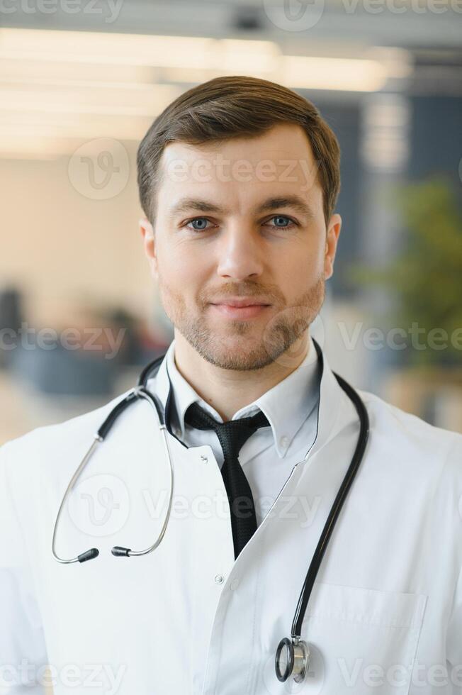 Portrait of friendly male doctor smiling photo