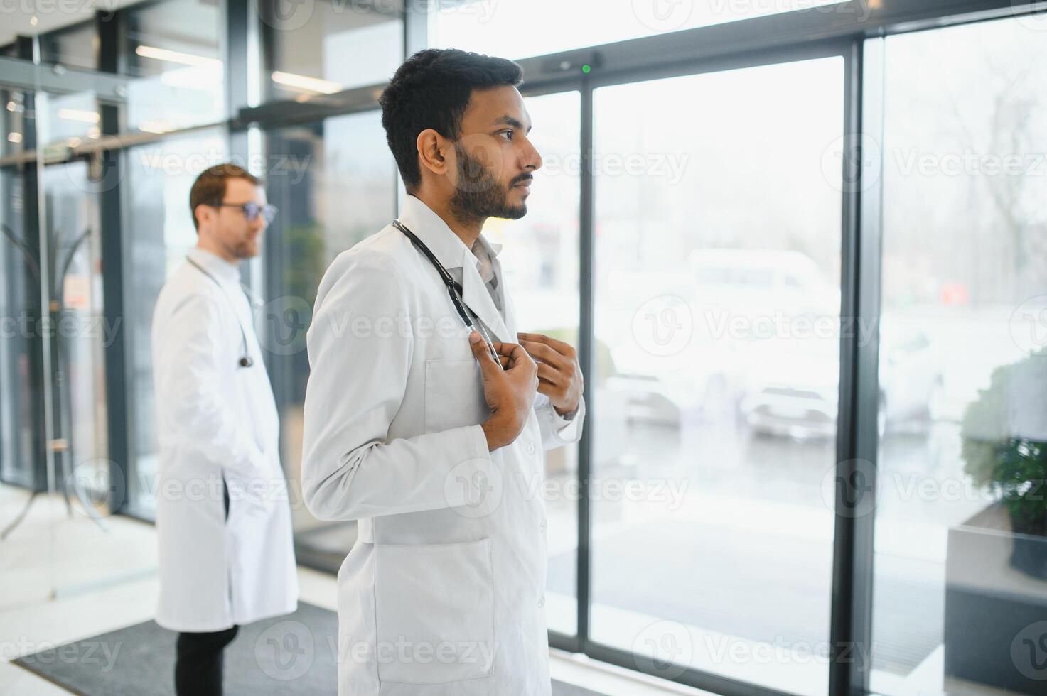 Portrait of a Asian Indian male medical doctor in uniform photo