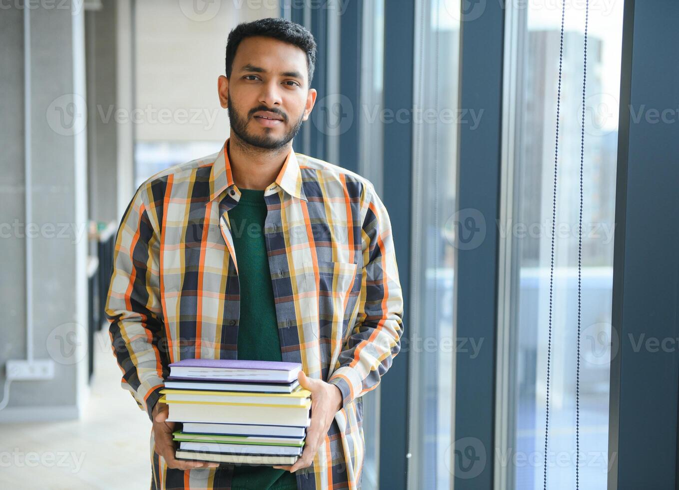 Handsome and young indian Male college student. photo