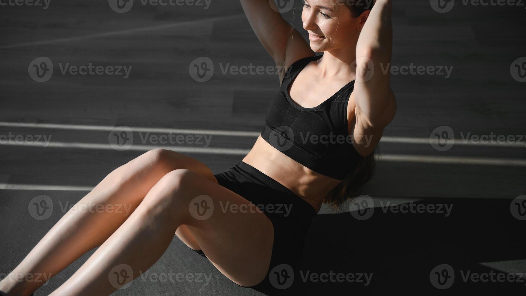 beautiful athletic woman working ab intervals in fitness photo