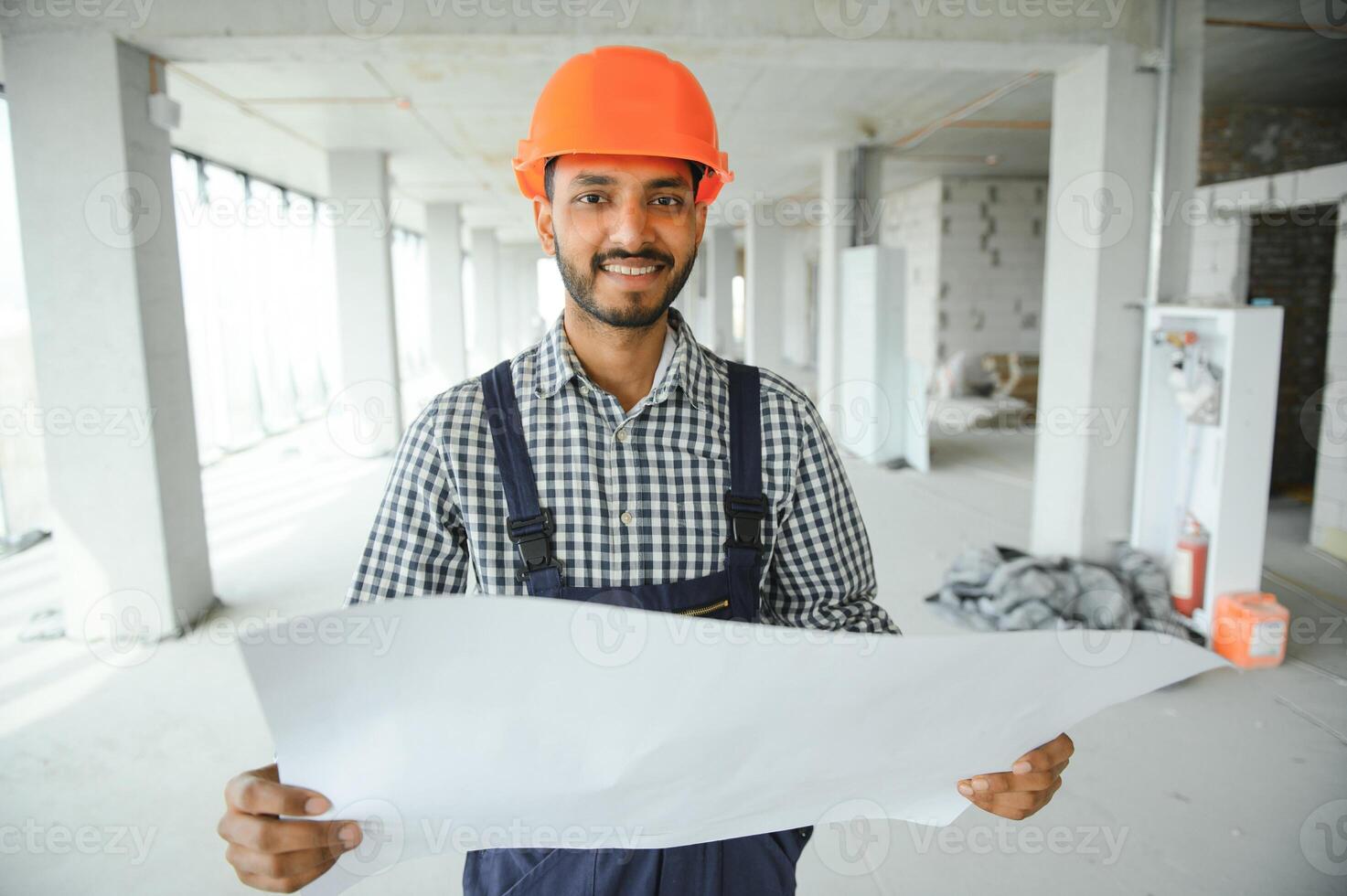 Portrait of a Indian engineer posing at the camera photo
