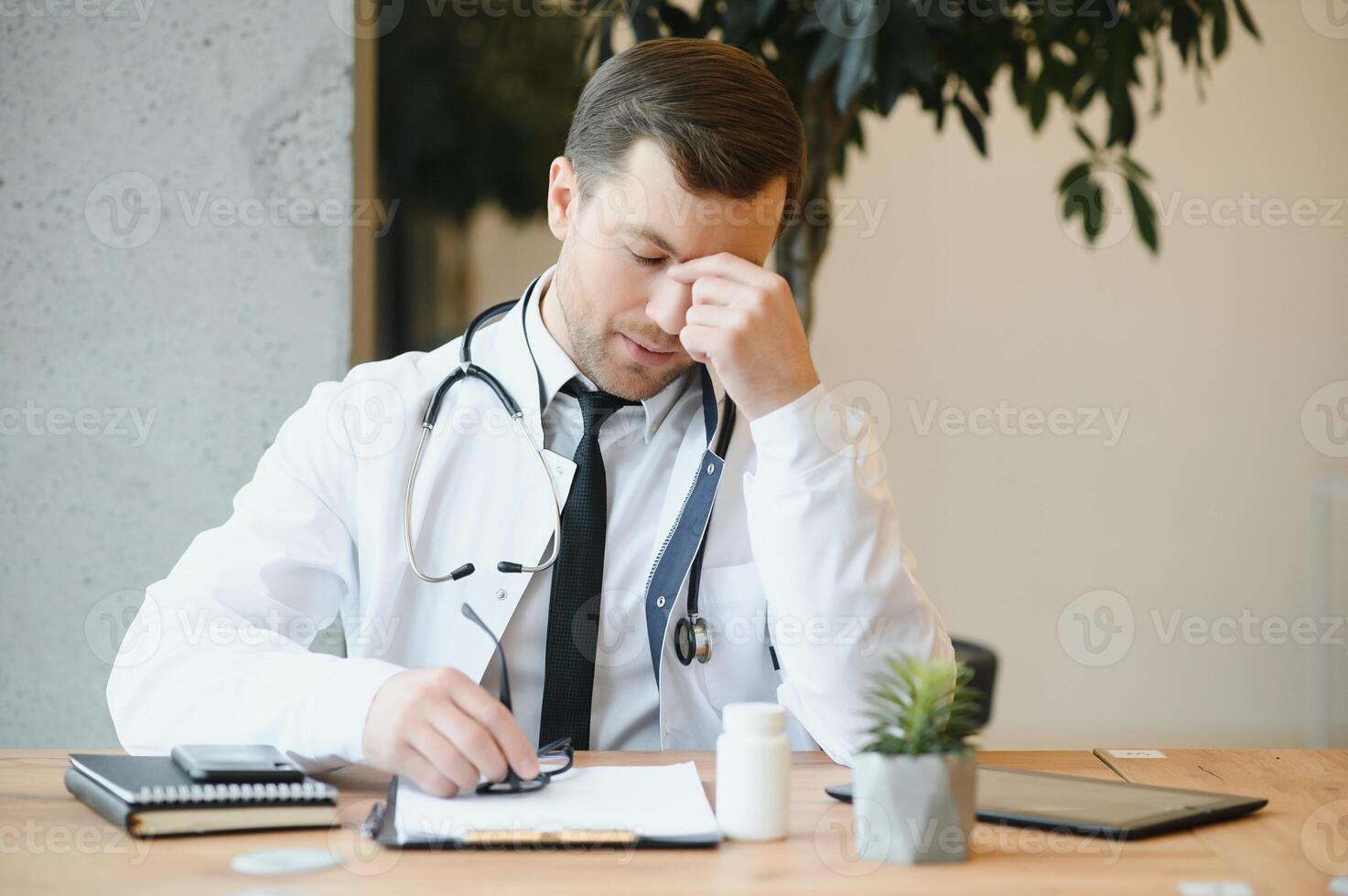 Portrait of a serious doctor in medical office. photo