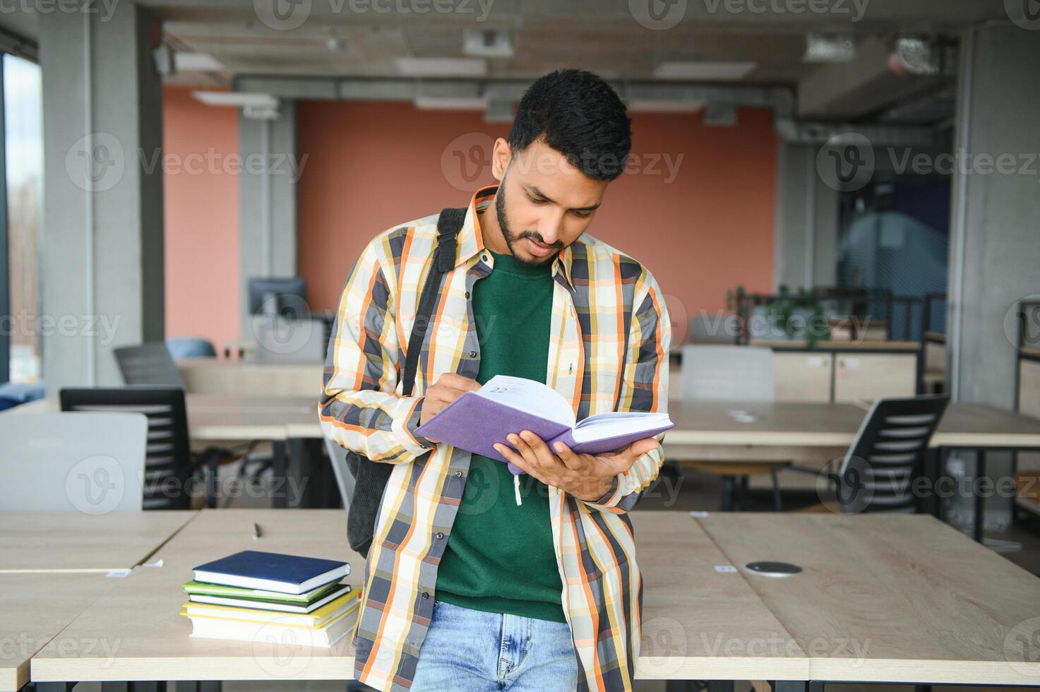 indian student with books at university photo