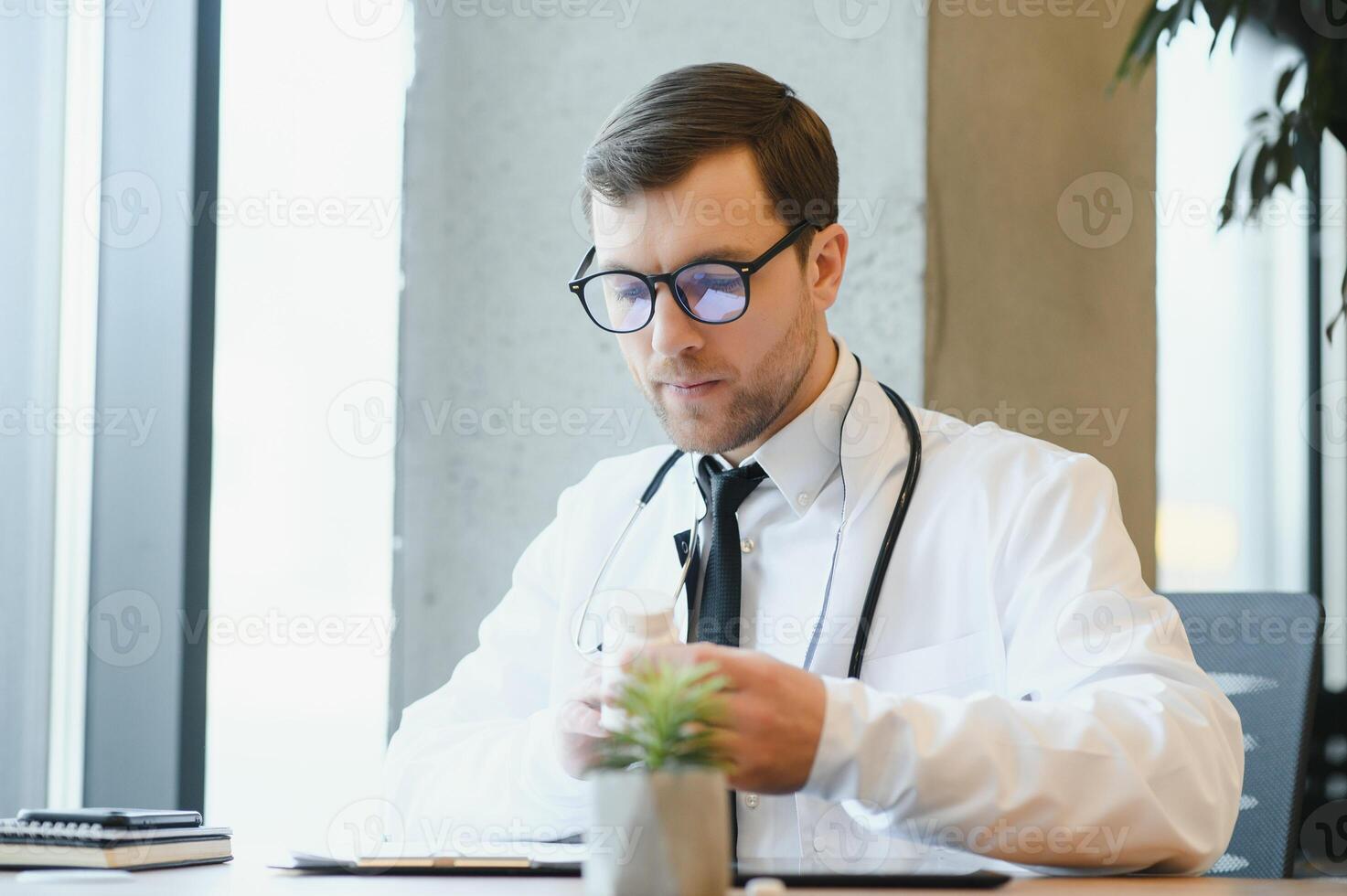 Male doctor working in clinic photo
