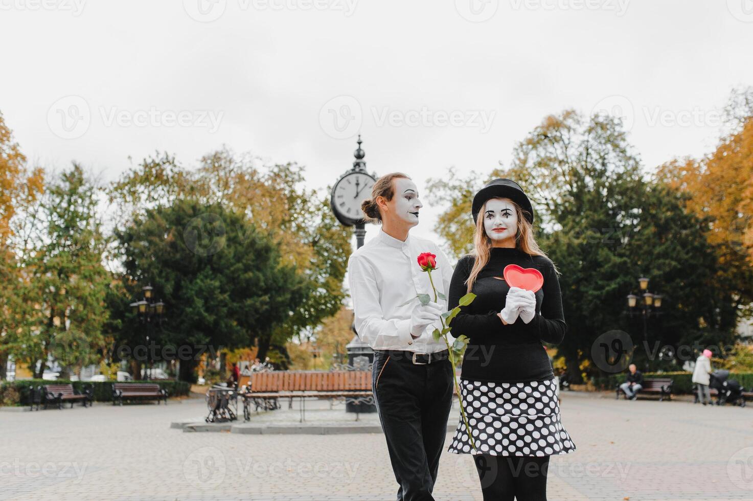 Mime on the street waiting to meet with his lover. Portrait of a mime comedian. mime on the street photo