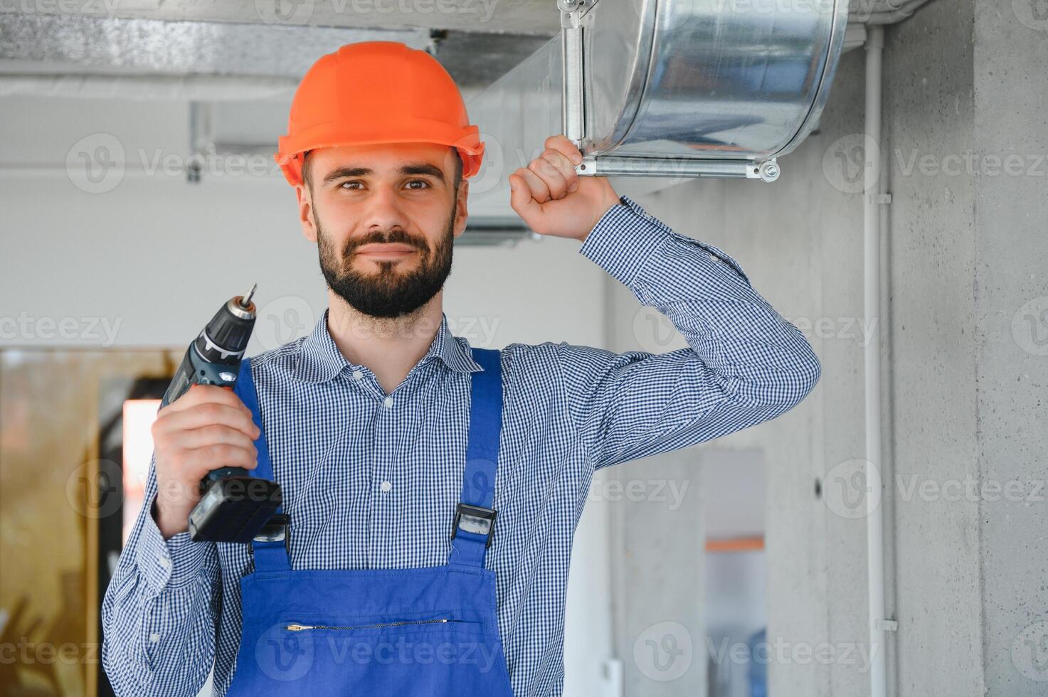hvac worker install ducted pipe system for ventilation and air conditioning. copy space photo