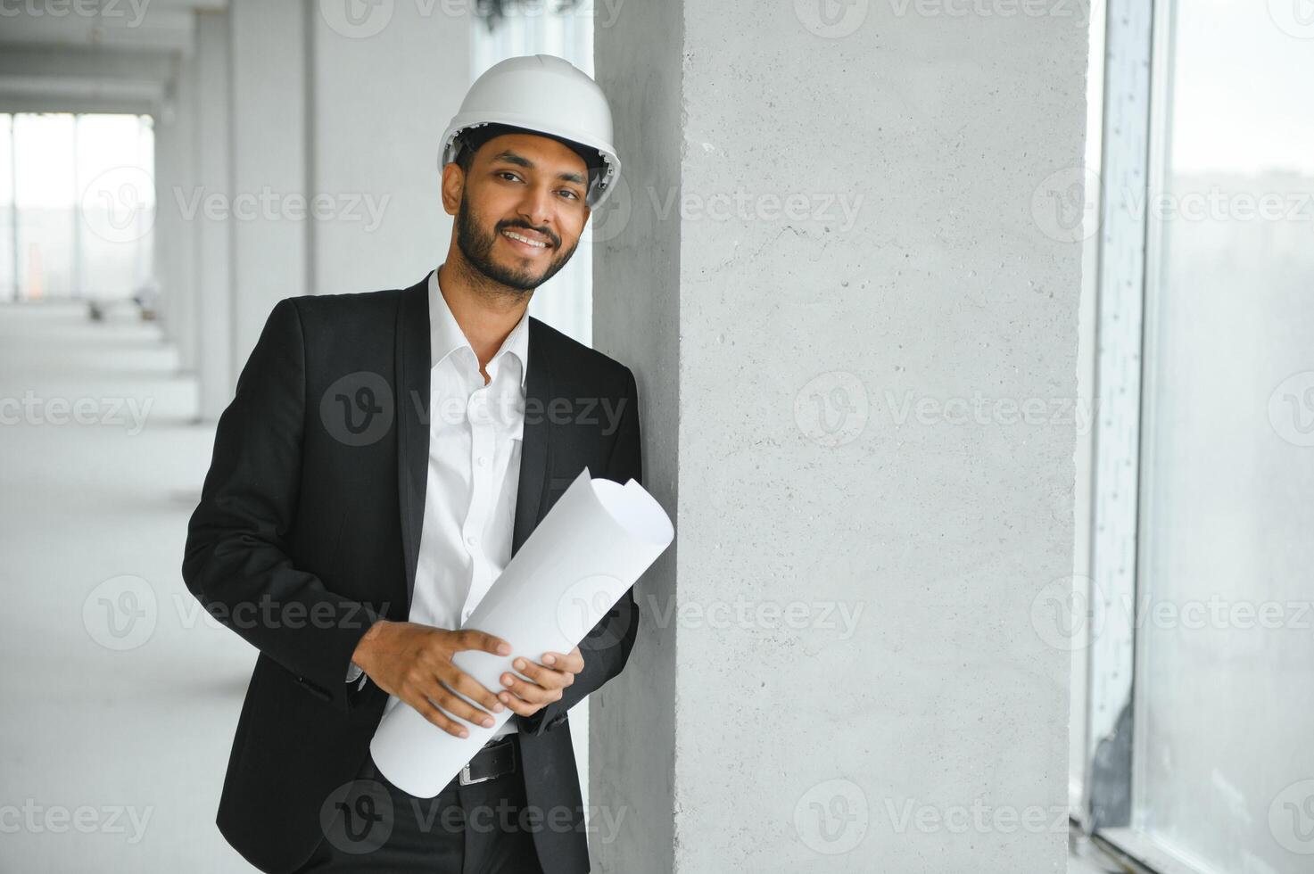 architecture, construction business and building concept - happy smiling indian male architect in helmet. photo