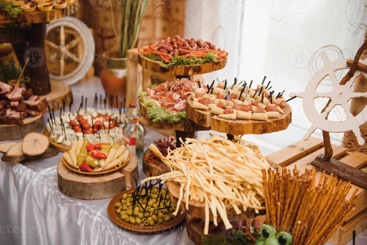 Meat and cheese appetizers. Antipasti and catering platter with different meat and cheese products. photo