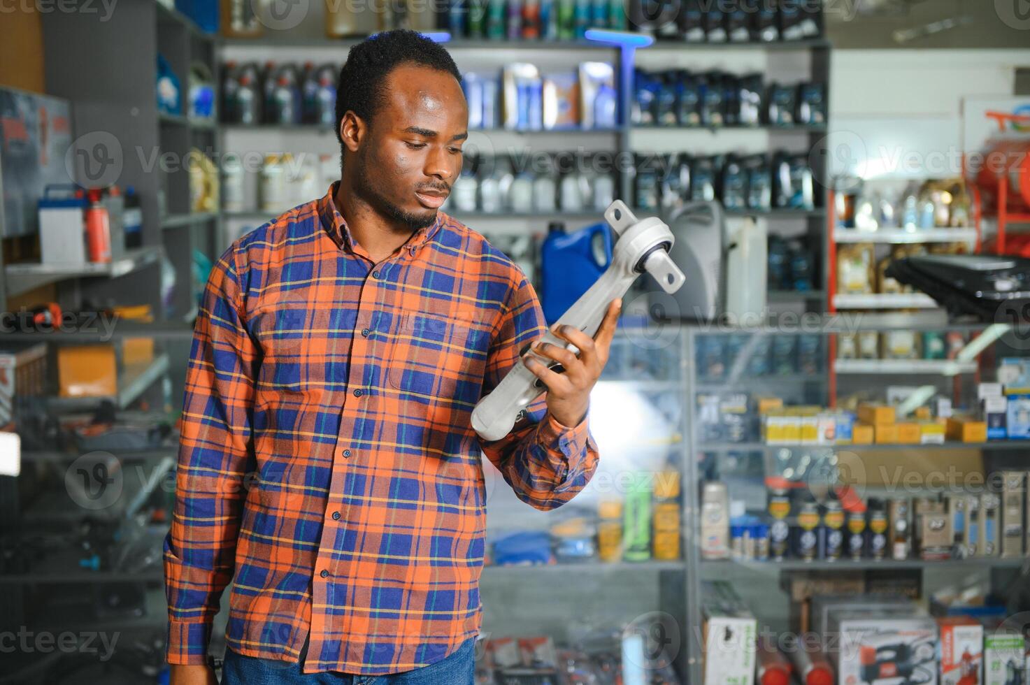 Smiling african Salesman Auto Parts Store photo