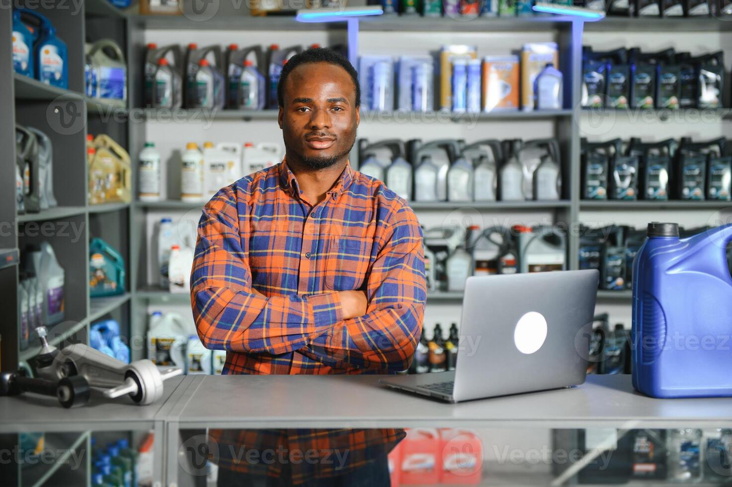 Smiling african Salesman Auto Parts Store photo