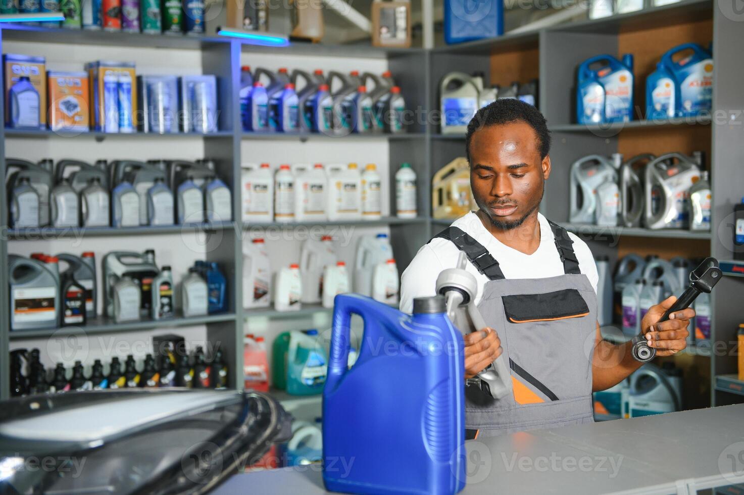 Smiling african Salesman Auto Parts Store photo