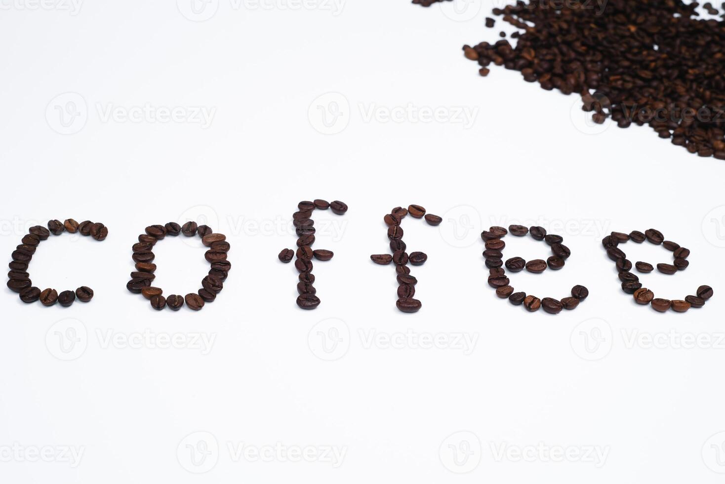 Word coffee made from coffee beans isolated on white background photo