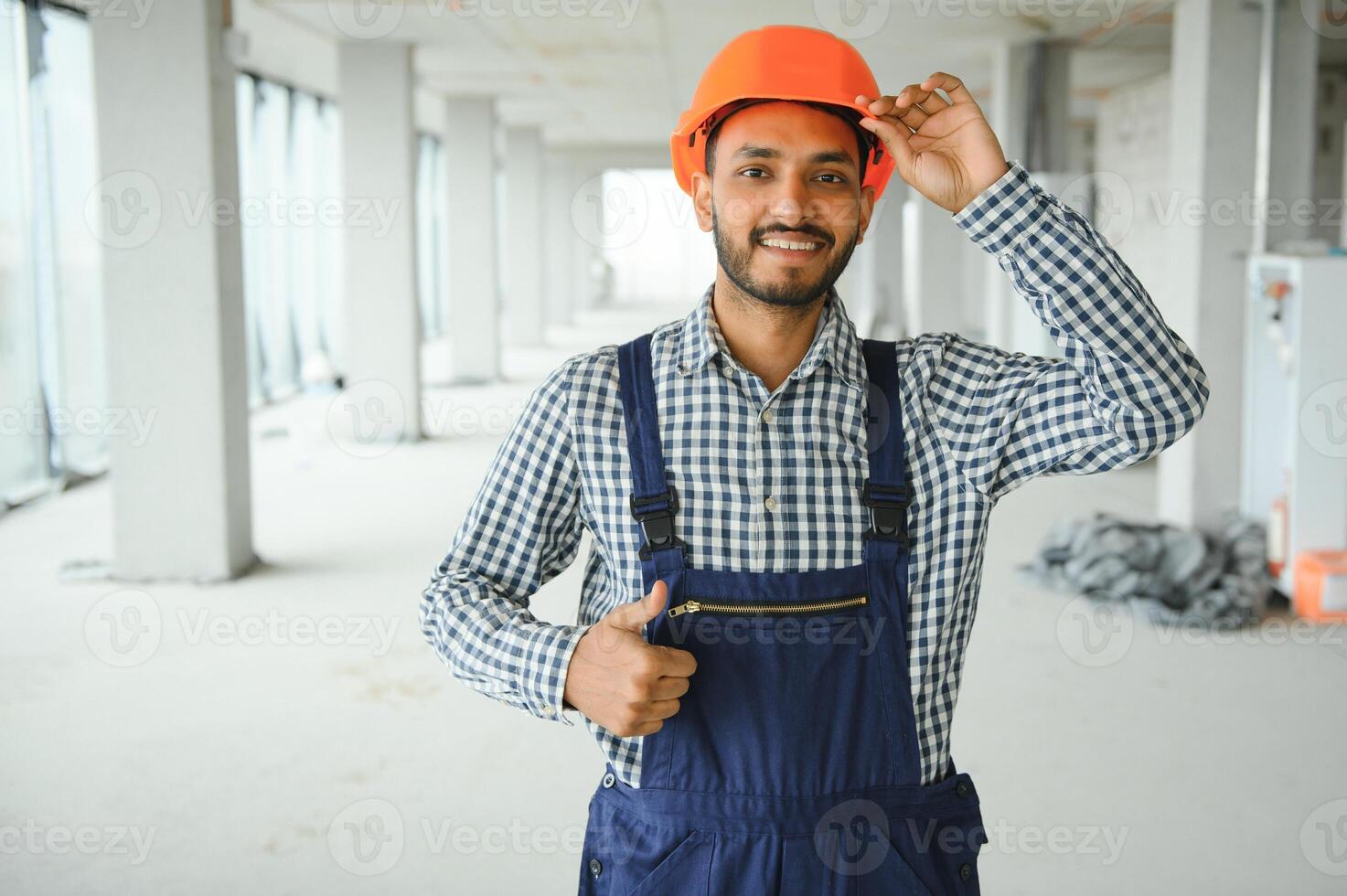 building, construction and people concept. Builder at construction photo