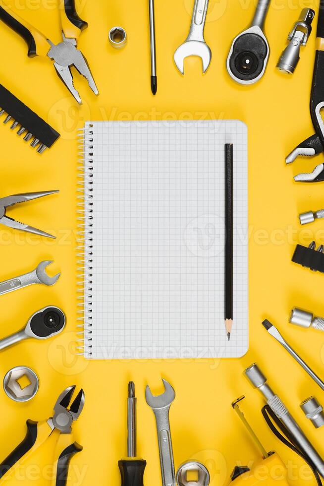 Set of various construction tools. Tools for home repair. Work at a construction site. On a yellow background. Flatly. Flatlay photo