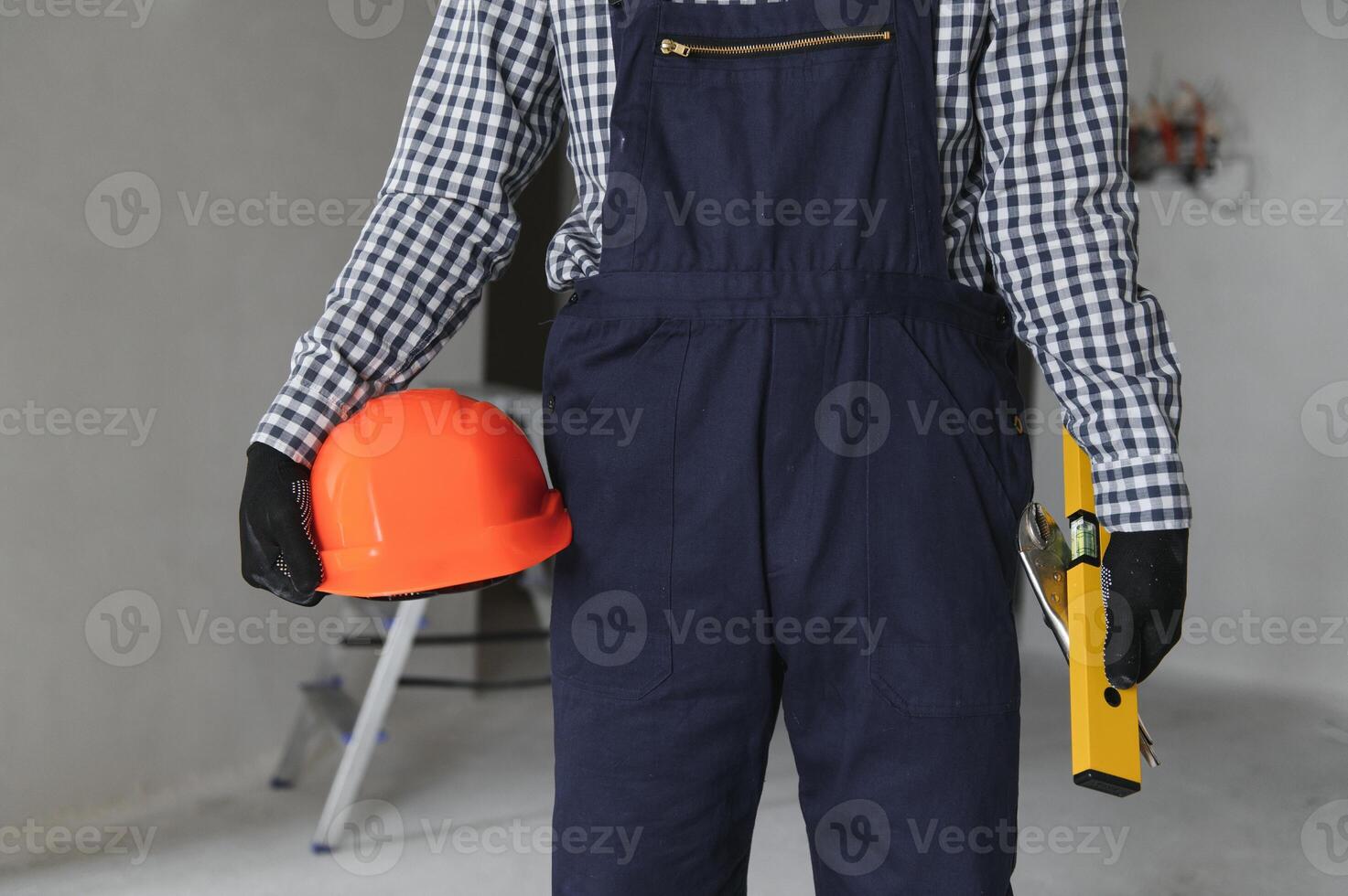 Young worker making repair in room photo