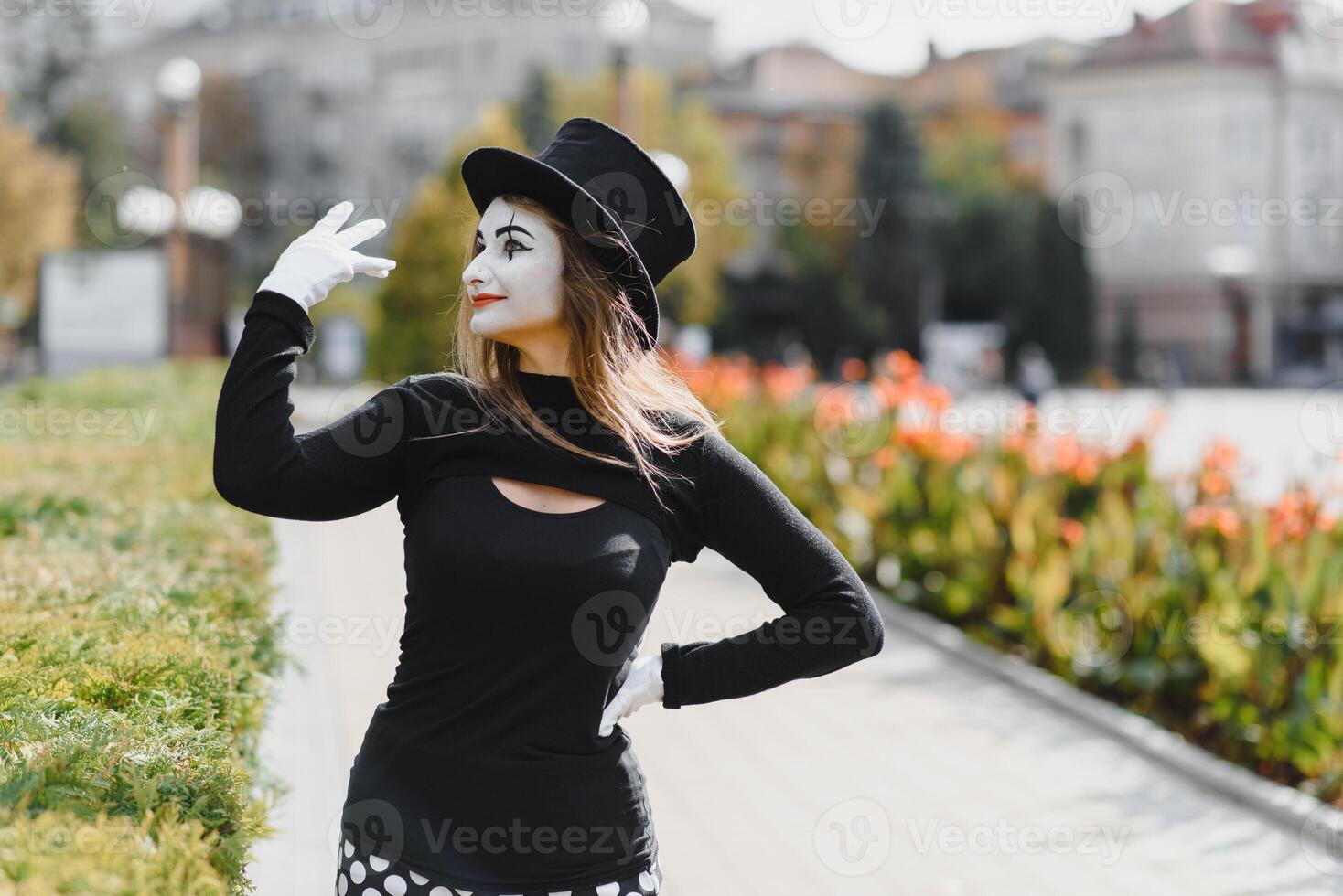 Portrait of a mime comedian. mime girl on the street photo