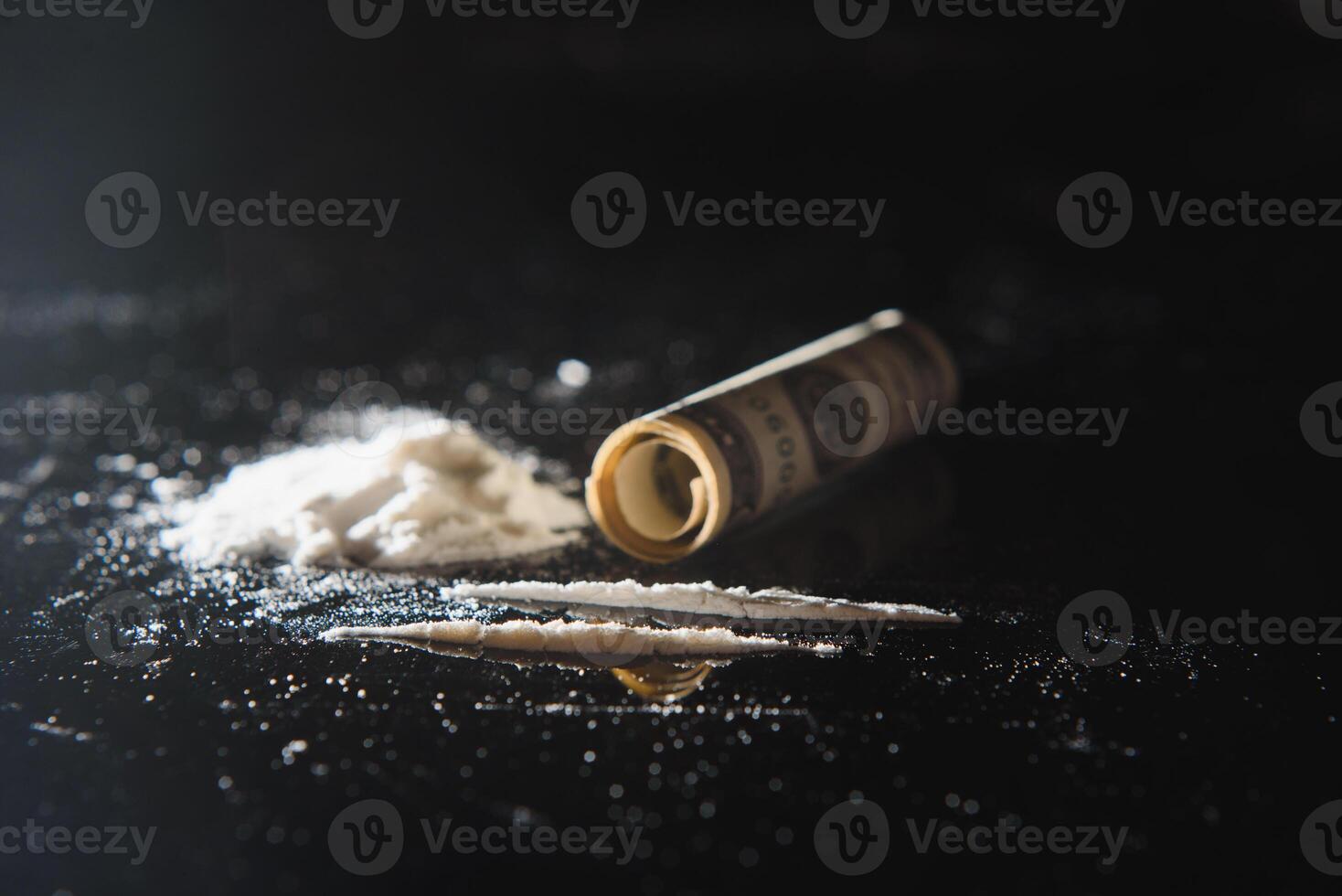 Cocaine and money isolated on black background. photo