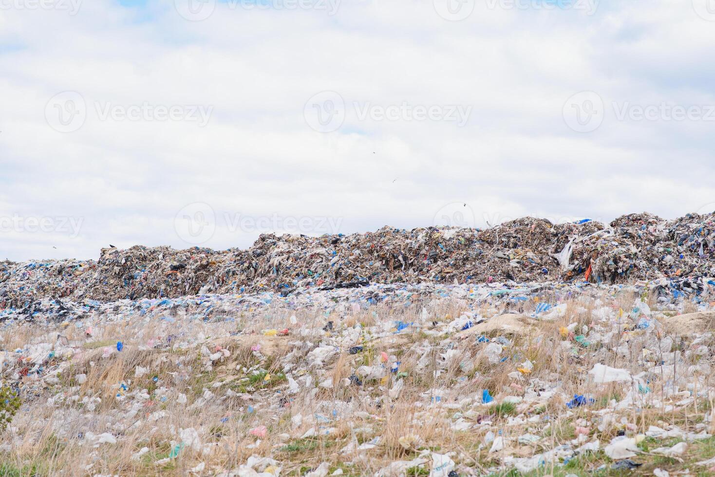 Mountain garbage, large garbage pile, degraded garbage. Pile of stink and toxic residue. These garbage come from urban areas, industrial areas. Consumer society Cause massive waste. Can not get rid of photo