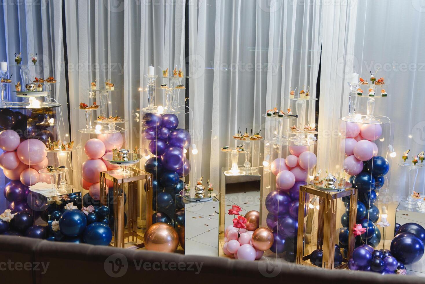 desserts with fruits, mousse, biscuits. Different types of sweet pastries, small colorful sweet cakes, macaron, and other desserts in the sweet buffet. candy bar for birthday photo