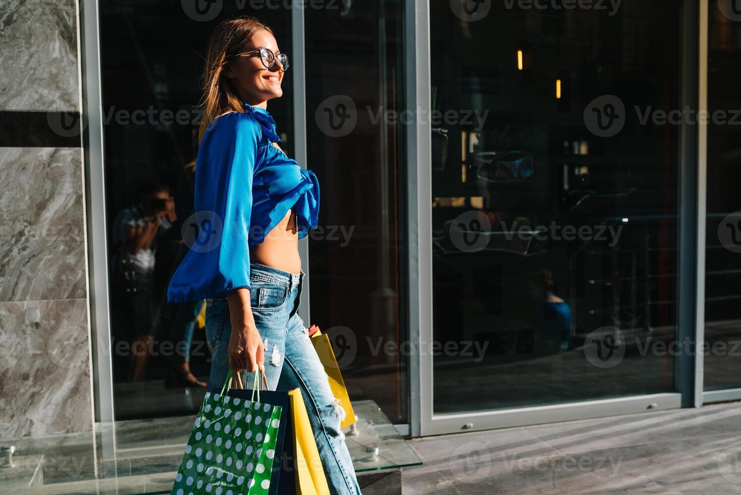 Woman in shopping. Happy woman with shopping bags enjoying in shopping. Consumerism, shopping, lifestyle concept. photo