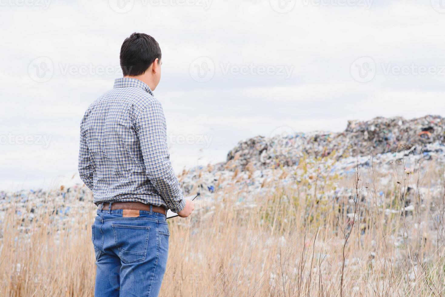 garbage recycling concept. man on dumpster. Keeping the environment clean. Ecological problems. photo