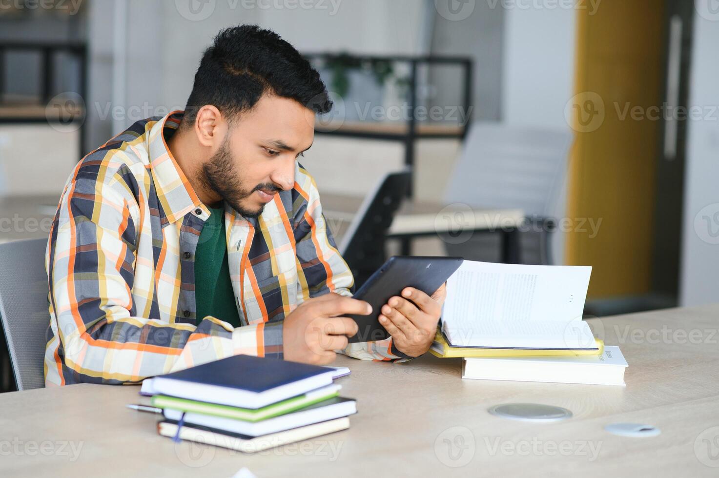 indian student with books at university photo