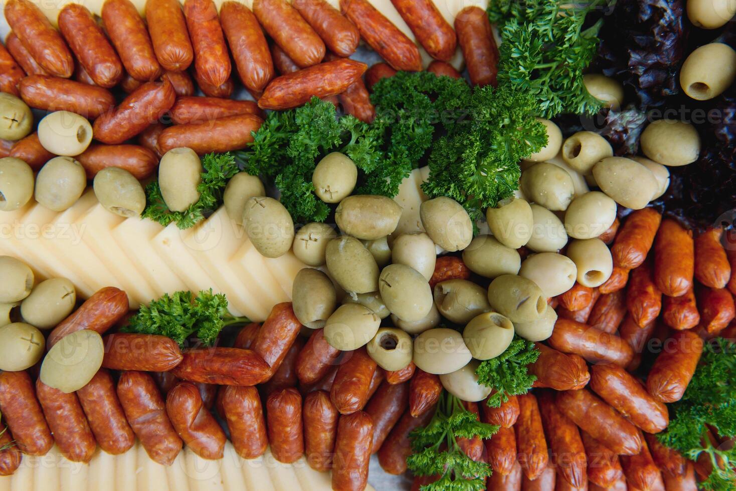 Meat and cheese appetizers. Antipasti and catering platter with different meat and cheese products. photo