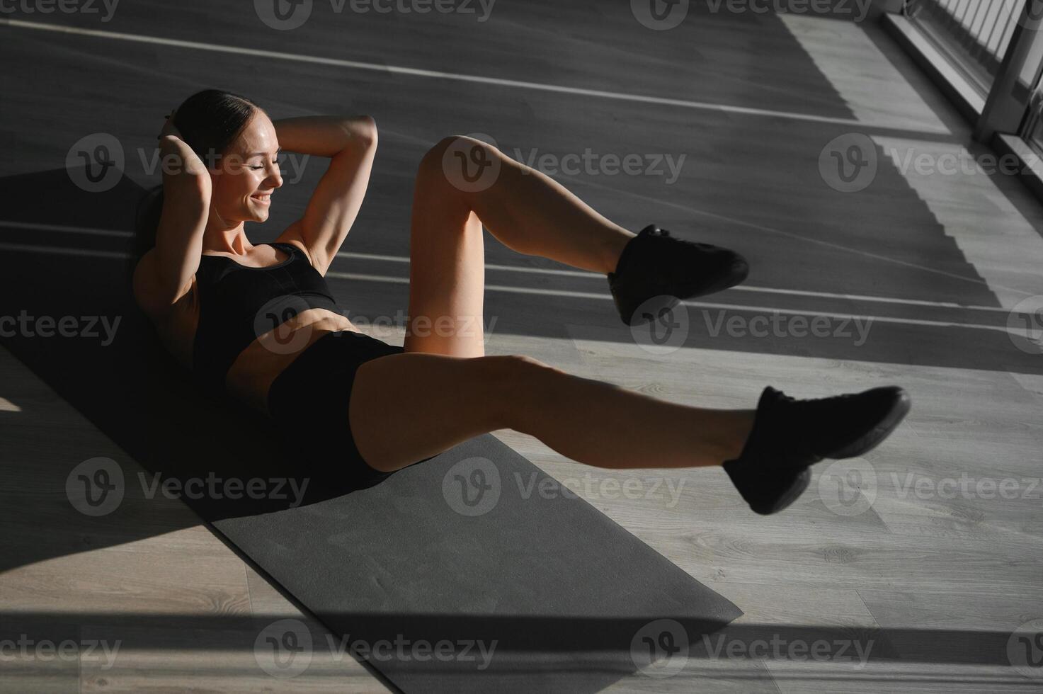 Close up image of attractive fit woman in gym. photo