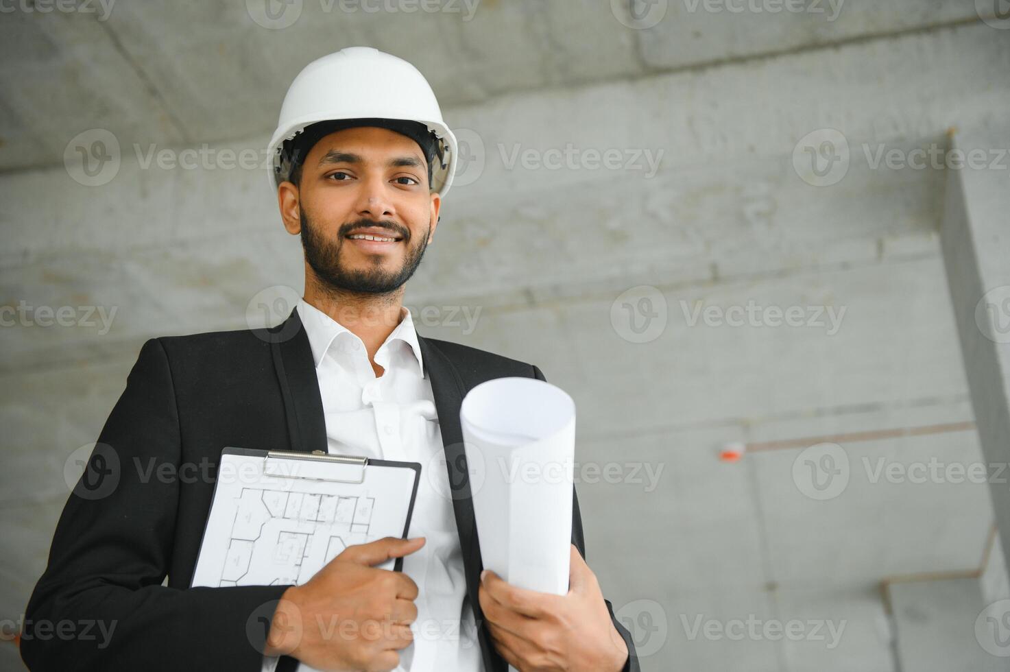 Asian Engineer standing on site construction posting confident , Engineer construction happy job success with in target planning photo
