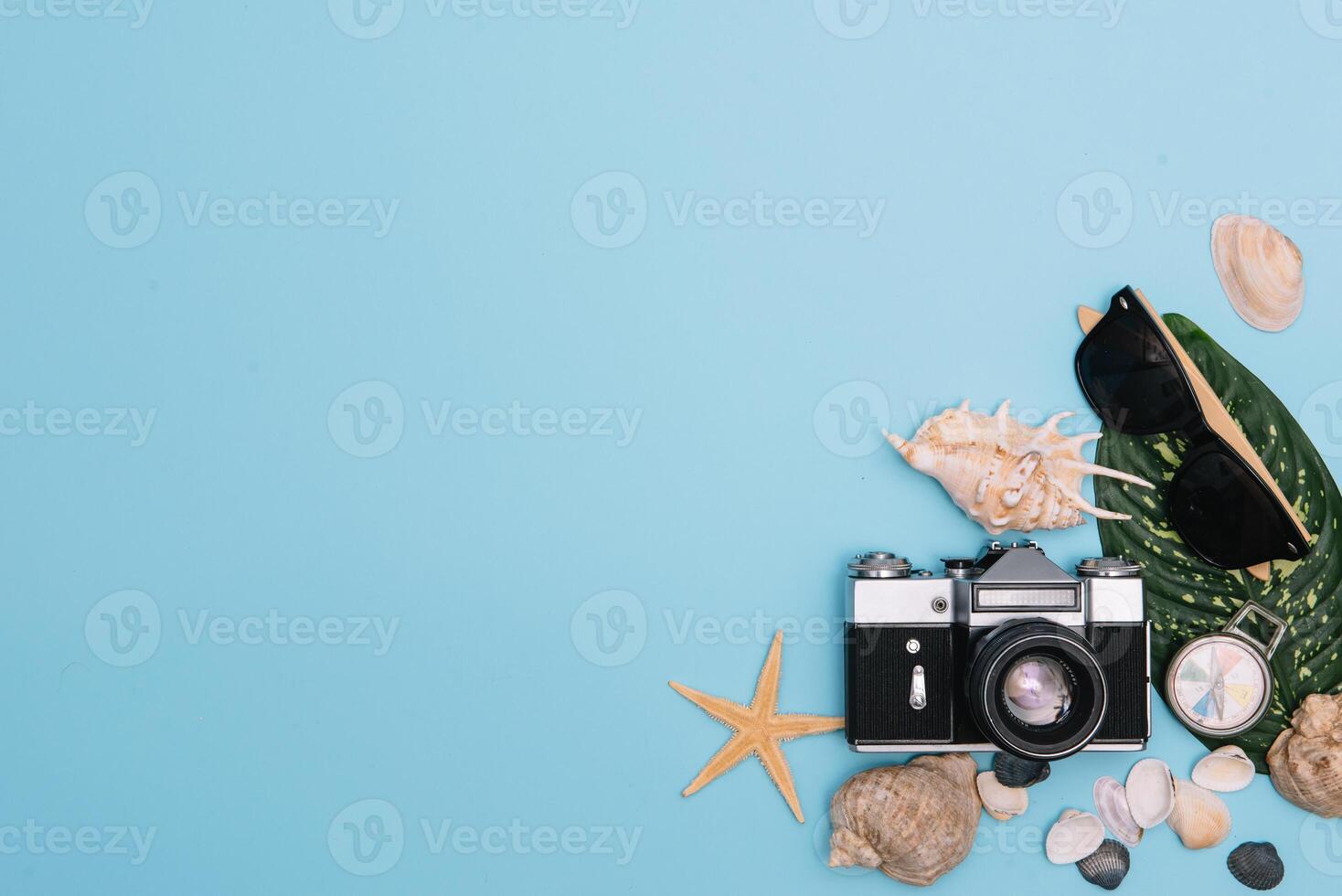 Preparation for Traveling concept, watch, airplane, money, passport, pencils, book, Photo frame, eyeglass on blue background with copy space.