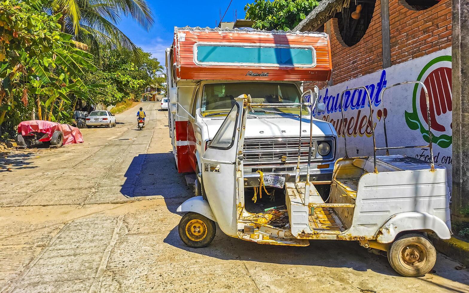 Puerto Escondido Oaxaca Mexico 2023 White tuk tuk tricycle TukTuks rickshaw in Mexico. photo