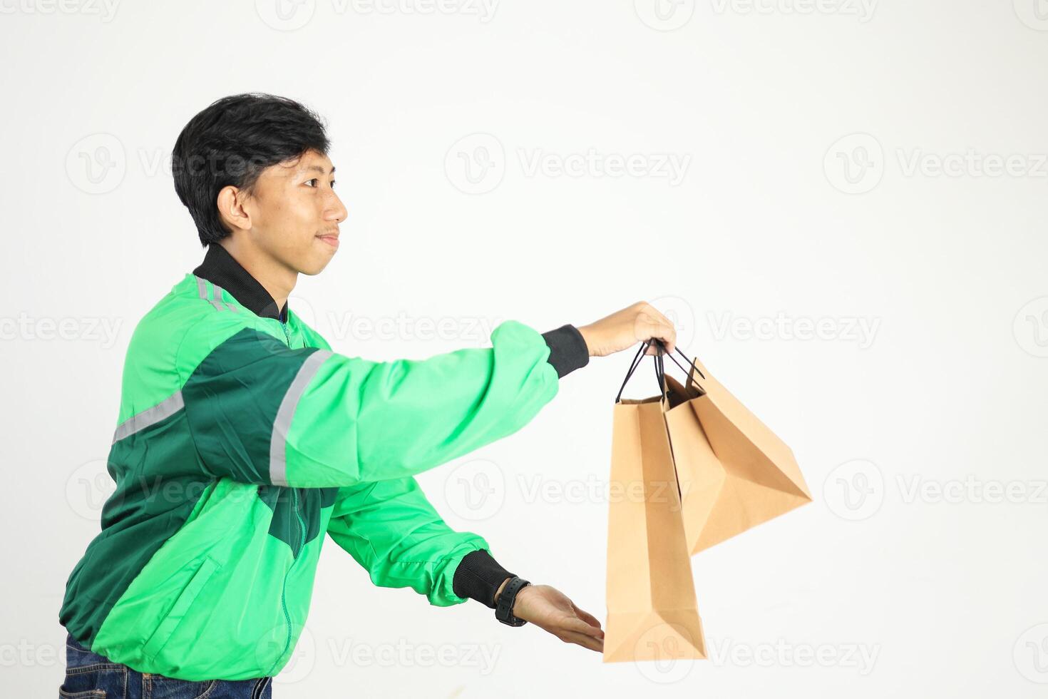 Side View Online Driver Delivering Package on Paper Bag photo