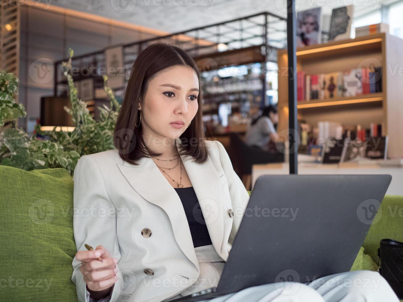 Businesswoman female lady girl person people look work computer notebook job occupation technology digital stock report office internet network wireless communication business connection manager using photo