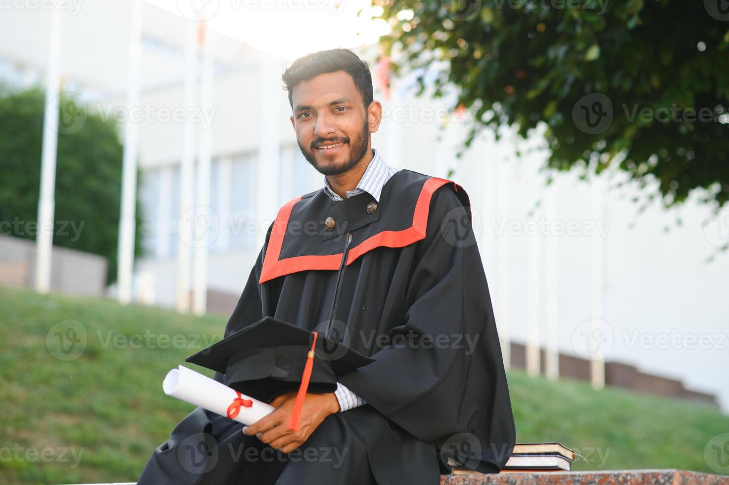 education, graduation and people concept - happy Indian Male graduate student. photo