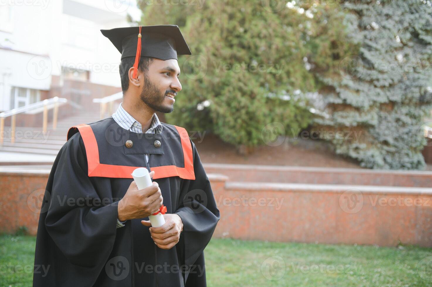 education, graduation and people concept - happy Indian Male graduate student. photo