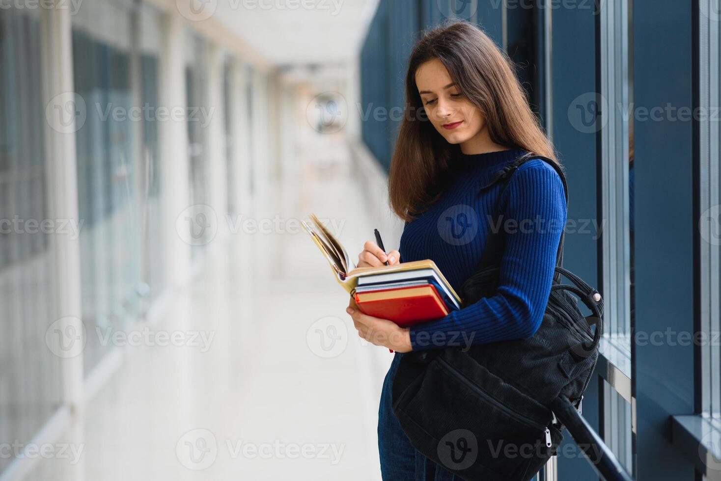 Smiling female student enhancing her future by attending regular lectures photo