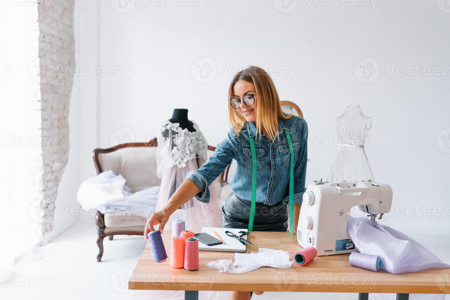 Fashion designer working in the studio photo